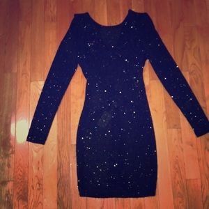 Black and gold backless dress .